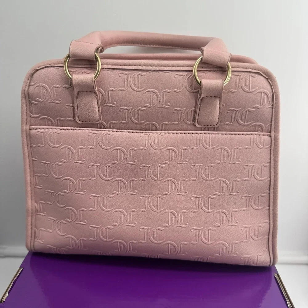 Y2K Juicy Couture satchel in pink, features an all-over embossed 